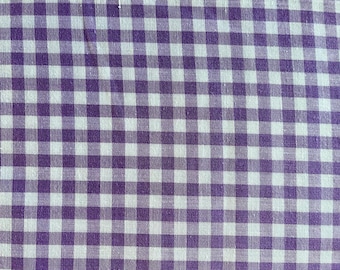 45" wide cotton polyester gingham check fabric in light purple on white, excellent condition. Selling by the yard.