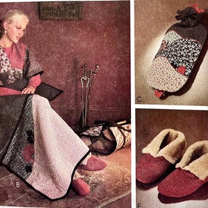 May include: A woman wearing a pink and black patterned robe sits on a couch with a quilt. The quilt is made of patchwork fabric with a red heart design. The woman is wearing red slippers. The image also shows a fireplace tool set and a quilted fire place cover.