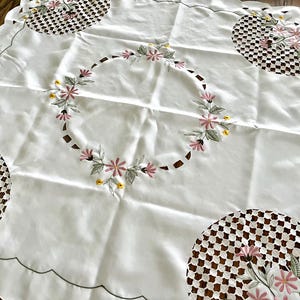 33.5&quot; wide x 34&quot; long square machine cutwork and embroidered polyester tablecloth or table topper, white with pink, green, yellow florals.