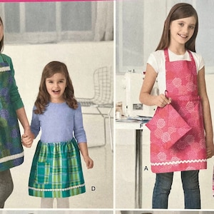 UNCUT 2011 Simplicity 2173 子供用「縫い方を学ぶ」エプロン パターン (Andrea Schewe 作)。サイズ 3 ～ 6、ビブフロント エプロン、ハーフ エプロンが含まれます。
