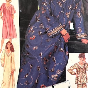 May include: A sewing pattern envelope featuring illustrations of various loungewear garments, including a blue floral robe, a pink short-sleeve robe, a cream long-sleeve robe, and a floral pajama set, with a partial ruler visible at the bottom.