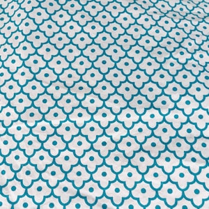 Queen-sized flat 100% cotton bed sheet by Exhilaration, turquoise on bright white, excellent condition.