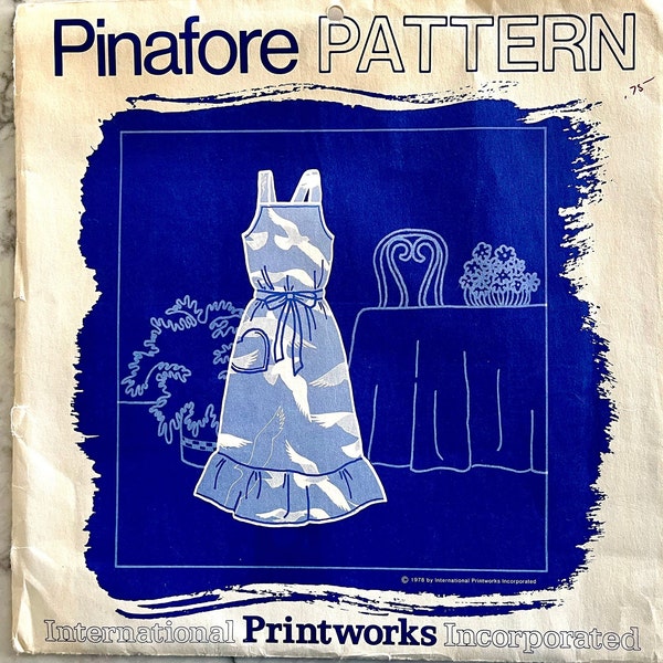 UNCUT 1978 International Printworks Incorporated pinafore pattern, one size fits all hostess pinafore with bottom ruffle.