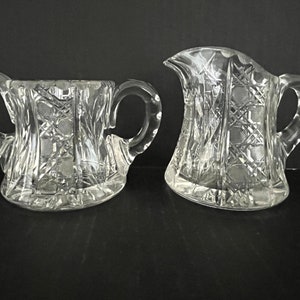 Antique cut glass creamer and sugar set, heavy base with star, cut vines, crosshatch patterns, stars, no chips or other damage!