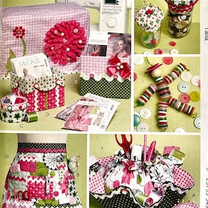 May include: A collection of sewing-themed items, including a sewing machine cover, storage boxes, and an apron. The items feature floral and polka dot patterns in pink, green, and white. The image also includes sewing patterns and notions.