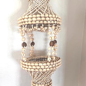 70's vintage seashell macrame plant hangar, cowrie shells, boho hippie beach shack coastal decor; 27" long.