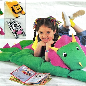 Complete 1994 Butterick 3721 animal pillow covers pattern for standard-sized pillows; dinosaur, lion, bear, cow all included.