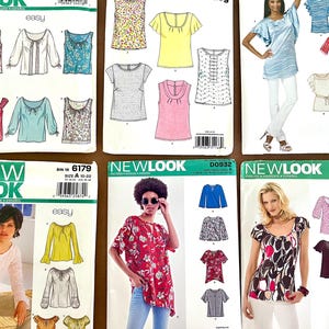 May include: A collection of sewing patterns for tops and blouses. The patterns feature various styles, including long-sleeved, short-sleeved, and sleeveless designs. The patterns are from the "New Look" and "Easy" brands.