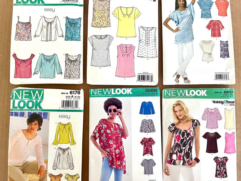 May include: A collection of sewing patterns for tops and blouses. The patterns feature various styles, including long-sleeved, short-sleeved, and sleeveless designs. The patterns are from the "New Look" and "Easy" brands.