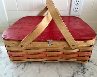 Vintage woven wood slat picnic basket with red wooden lid, two handles; 13.5" wide x 11.5" long x 4.75" deep.