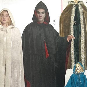 May include: Image of a pattern for hooded capes in various styles. One cape is white, another is black with a red lining, and a third is brown with a faux fur trim. A blue hooded cape is also shown.