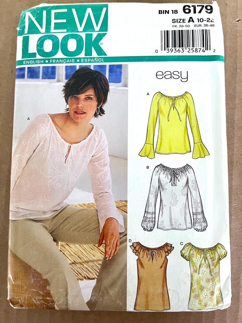 May include: A sewing pattern from New Look featuring designs for women's blouses. The pattern includes illustrations of various blouse styles, including a yellow long-sleeved blouse with flared sleeves, and a white blouse with lace details. The text "easy" is visible.