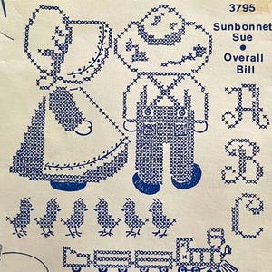 UNCUT vintage Aunt Martha's 3795 'Sunbonnet Sue and Overall Bill' hot iron transfers for cross-stitch embroidery and textile painting.