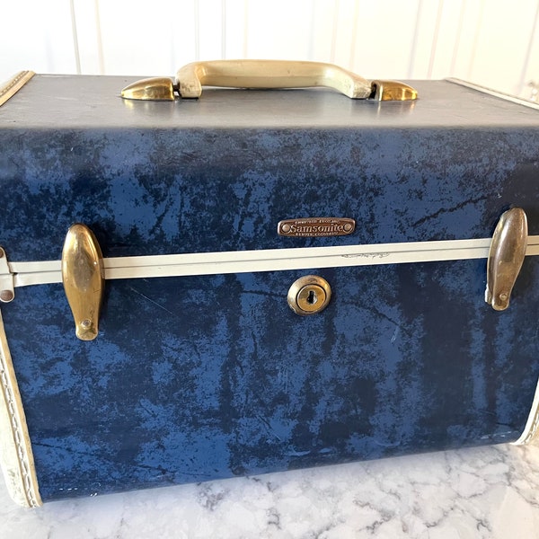 Vintage Samsonite train case in Admiral blue with white trim and handle, brass buckles and trims,  good condition with wear--see photos.