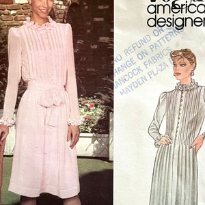 UNCUT 1980&#39;s Vogue 2641 misses&#39; Albert Nipon designed dress in 2 lengths with front tucks and ruffled neckline, sleeves; size 14, bust 36&quot;.