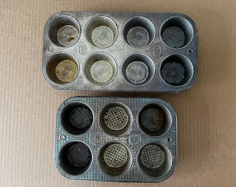 Vintage cupcake and muffin tins, one 6-cup is Ovenex waffle pattern, the other is 8-cup Ovenex starburst, some tarnish.