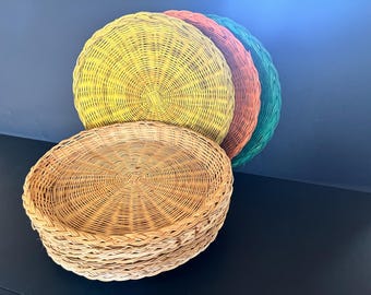Set of 10 1960's or 1970's wicker woven paper plate holders, all in excellent condition, some in fun colors, 10" in diameter.