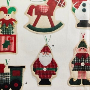 May include: A set of 7 felt Christmas ornaments, including a rocking horse, a snowman, a jester, a Santa Claus, an elf, and a train. The ornaments are all in red, green, and white.