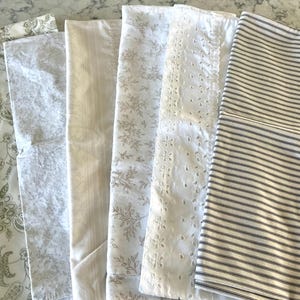 Vintage and not so vintage pillowcases in muted colors and patterns, some all cotton, some all poly, some a blend, all in terrific condition