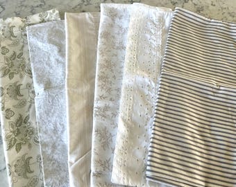 Vintage and not so vintage pillowcases in muted colors and patterns, some all cotton, some all poly, some a blend, all in terrific condition