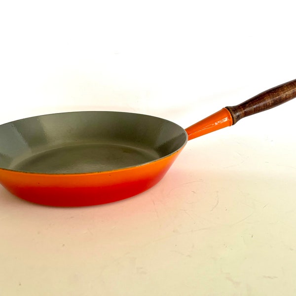 Vintage Le Creuset #28 flame red-orange enameled cast iron saute or fry pan with wooden handle, excellent condition.