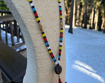 Colors of the Yaqui flag beaded double strand Ojo de Venado necklace with traditional red tassel