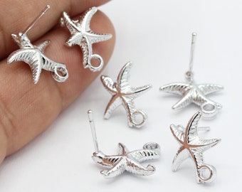May include: Six silver starfish earring charms with jump rings. The charms are designed with a detailed starfish shape and are ready to be added to earrings.