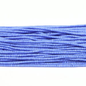 May include: A close-up of a strand of light blue seed beads. The beads are small and uniform in size, creating a smooth and consistent texture.