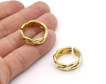 May include: Two gold-colored braided rings. The rings are open and can be adjusted to fit different finger sizes.