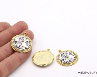 May include: Three gold-toned metal charms with a silver-toned design. Two charms feature a profile of a person's face, and one charm has a textured design.