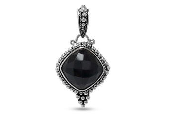 May include: A silver pendant with a large, faceted black gemstone in a square shape. The pendant has a decorative beaded border and a detailed bail for a chain. The design is symmetrical and features a small cluster of beads at the bottom.