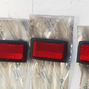 Mercedes W126 Interior Door End Reflector 4 pcs with Gasket 1268200074 NOS .
