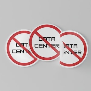 May include: Three circular stickers featuring a red prohibition symbol over the words "DATA CENTER" in black. The stickers are white with a red border, set against a grey backdrop.