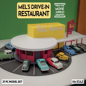 May include: A 37-piece model set of Mel's Drive-In Restaurant from the movie American Graffiti. The set includes a yellow building with the restaurant's name, a red and white diner, and several miniature cars. The scale is 1/64.