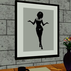 May include: A black and white silhouette of a woman in a framed picture. The woman is wearing a necklace and a skirt. The picture is hanging on a wall.
