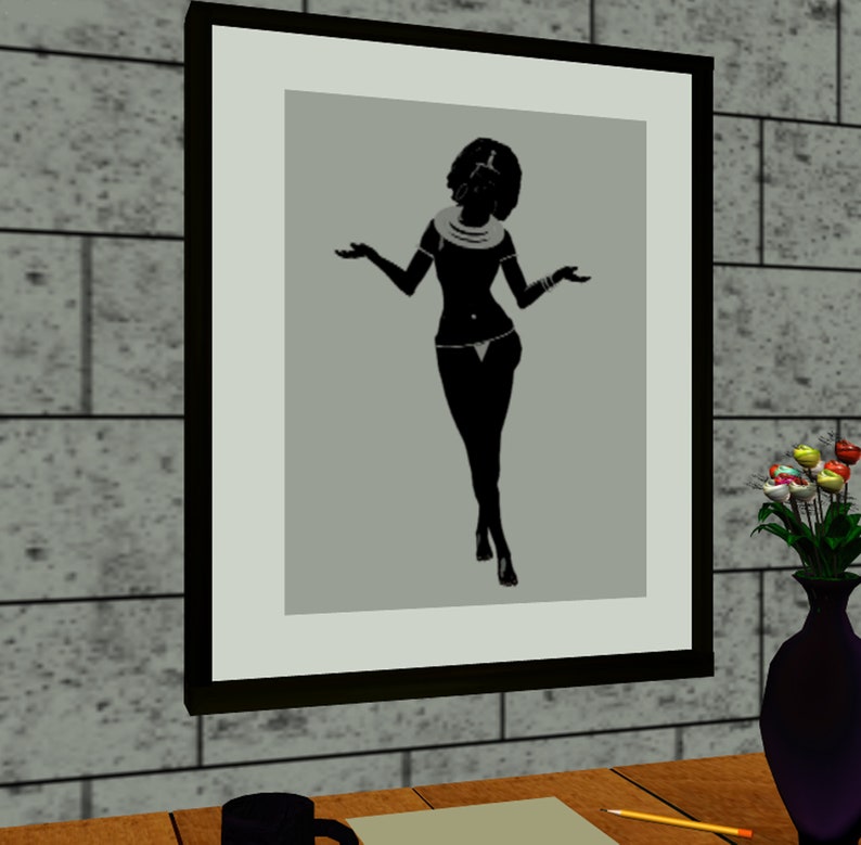 May include: A black and white silhouette of a woman in a framed picture. The woman is wearing a necklace and a skirt. The picture is hanging on a wall.