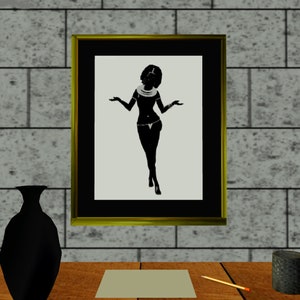 May include: A framed black and white silhouette of a woman wearing a necklace and a skirt, standing with her arms outstretched.