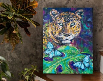 Leopard in the jungle with blue butterflies. Feel the wild energy of the beast and recharge your batteries for new achievements. "Be strong'