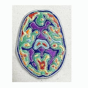 May include: A colorful embroidered patch depicting a brain with intricate details in shades of green, purple, blue, orange, and yellow.