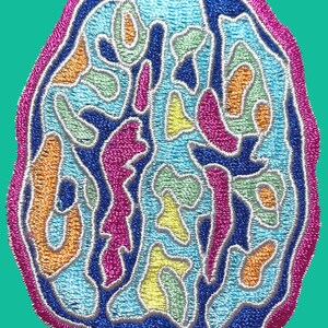 May include: A colorful embroidered patch with a brain-like design. The patch features a variety of colors, including blue, green, orange, pink, and yellow. The design is intricate and detailed, with a variety of shapes and curves.