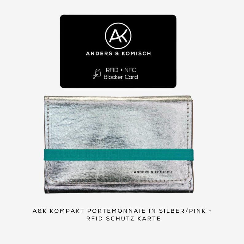 May include: A silver wallet with a teal elastic band and the text "ANDERS & KOMISCH". Above the wallet is a black card with the same logo and text, including "RFID + NFC Blocker Card".