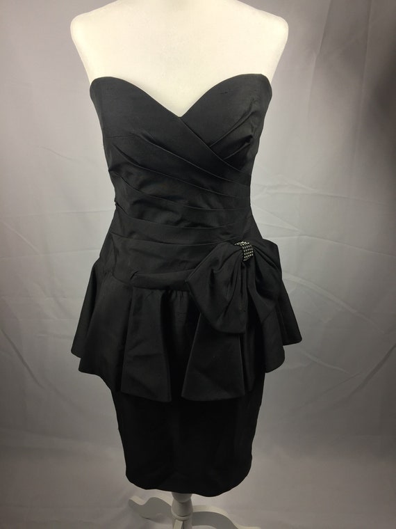 black peplum cocktail dress