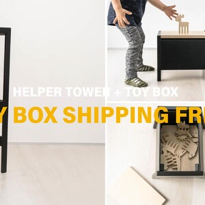 May include: A black wooden helper tower that converts into a toy box with a natural wood top. The structure features a step for climbing and a storage compartment. Text on the image reads HELPER TOWER + TOY BOX. The design is functional and modular.