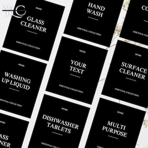 May include: A collection of black and white labels for household cleaning products. The labels feature text such as "Glass Cleaner", "Hand Wash", "Surface Cleaner", "Washing Up Liquid", "Dishwasher Tablets", and "Multi Purpose". The labels also include "Essential Collection".
