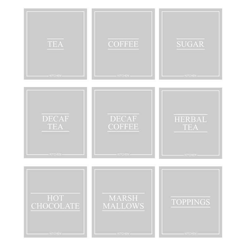 May include: Nine gray kitchen labels with white text. The labels read: TEA, COFFEE, SUGAR, DECAF TEA, DECAF COFFEE, HERBAL TEA, HOT CHOCOLATE, MARSHMALLOWS, and TOPPINGS. Each label has a white border and the word "KITCHEN" at the bottom.