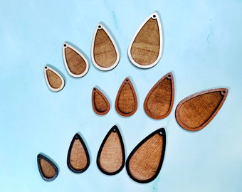 May include: Assortment of wooden teardrop-shaped earring blanks in various sizes. The blanks are unfinished and ready to be painted, stained, or decorated.
