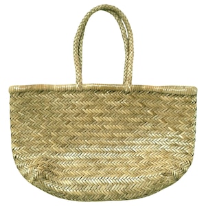 May include: Woven straw tote bag with braided handles. The bag features a natural, light brown color and a basket weave pattern. The handles are sturdy and designed for comfortable carrying. This bag is suitable for shopping or as a beach bag.