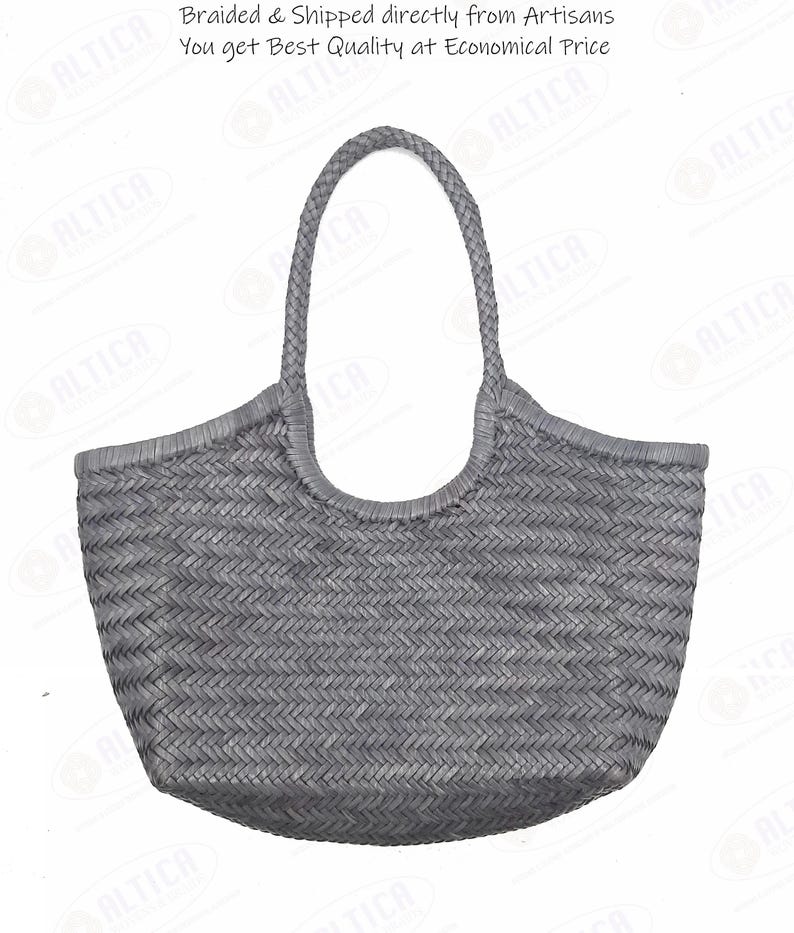 May include: A gray woven tote bag with a braided handle. The bag has a rounded shape and a textured surface. The text on the image says "Braided & Shipped directly from Artisans You get Best Quality at Economical Price."