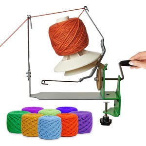 May include: A green metal yarn ball winder with a white plastic cone and a hand crank, featuring a metal guide arm and a clamp base. Below are eight yarn cakes in vibrant colors including green, yellow, blue, orange, purple, and lime green.