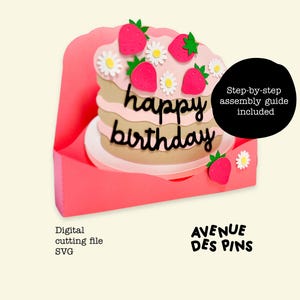 May include: A layered paper cake with pink frosting, strawberries, and daisies, with the words "happy birthday" in black script. The cake sits inside a pink card. Includes a step-by-step assembly guide. Digital cutting file SVG.
